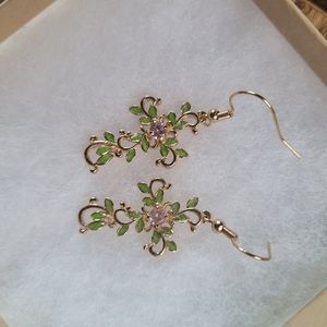 Gold earrings cross leaves